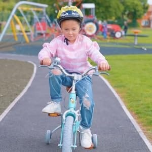 child riding beehive bicycle